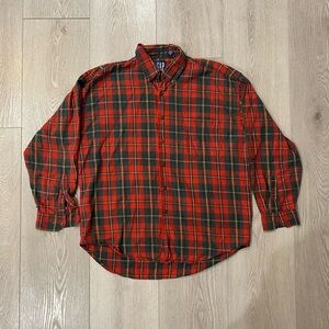 Plaid long sleeve shirt. Missing buttons on arms